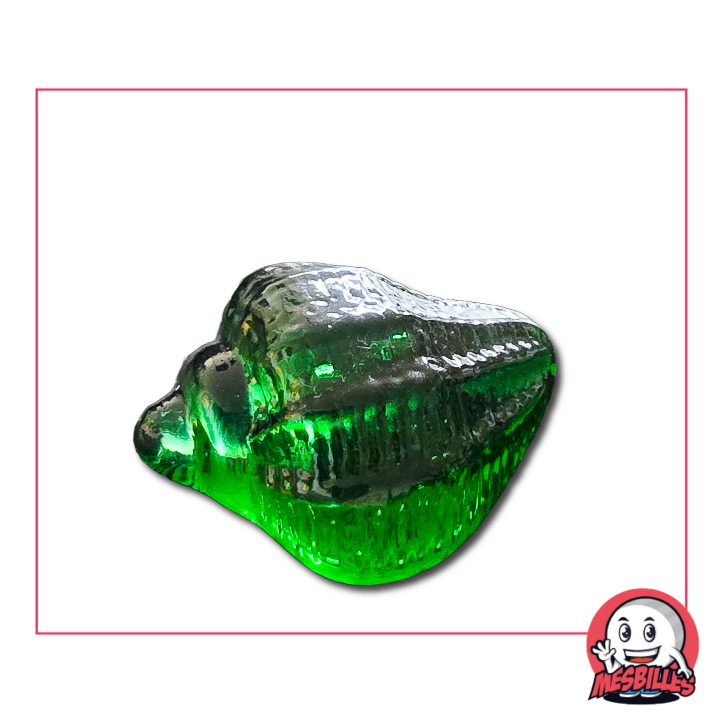 Photo of a green translucent marble in the shape of a sea snail, 5 cm, sold individually on My-Glassmarbles.