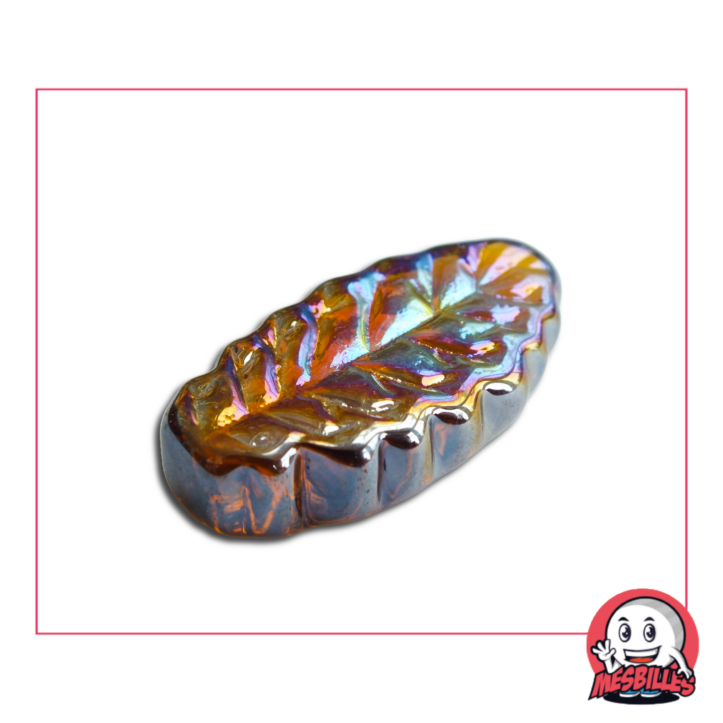 Photo of an ash leaf-shaped flat marble in iridescent amber glass, 4 cm, sold individually on My-Glassmarbles.