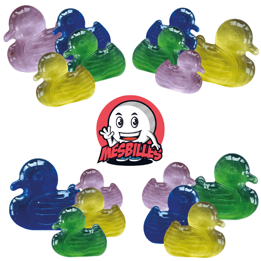 Picture of the My-Glassmarbles Mascot surrounded by Yellow Duck Extra-flat marbles, the sun of the Shaped Marbles at My-Glassmarbles