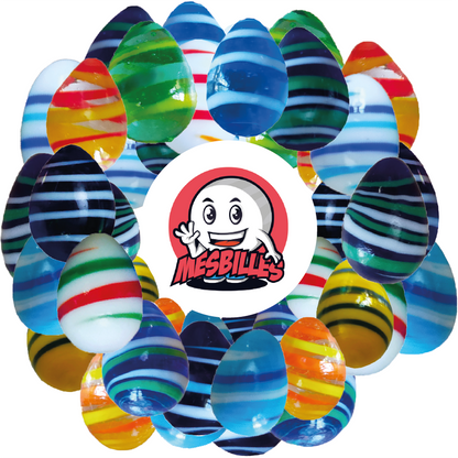 Image of My-Glassmarbles Mascot surrounded by Marbles My-Glassmarbles Egg, unexpected shape, translucent green glass with yellow and green stripes, 25mmMy-Glassmarbles Egg, unexpected shape, translucent green glass with yellow and green stripes, 25mm